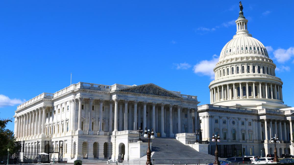 Capitol dome against blue sky