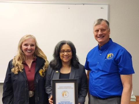 Congresswoman Strickland posing with Hope for Heroes Co-Founders