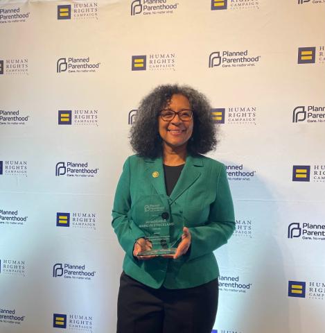 Congresswoman Strickland holding the Planned Parenthood's 2023 Champion of Reproductive Health Award